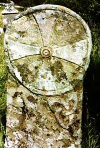 An encircled equidistant cross set above Brigid's Knots, found at Killaghtee in County Donegal, Ireland. Image from Irish Megaliths (see link below).